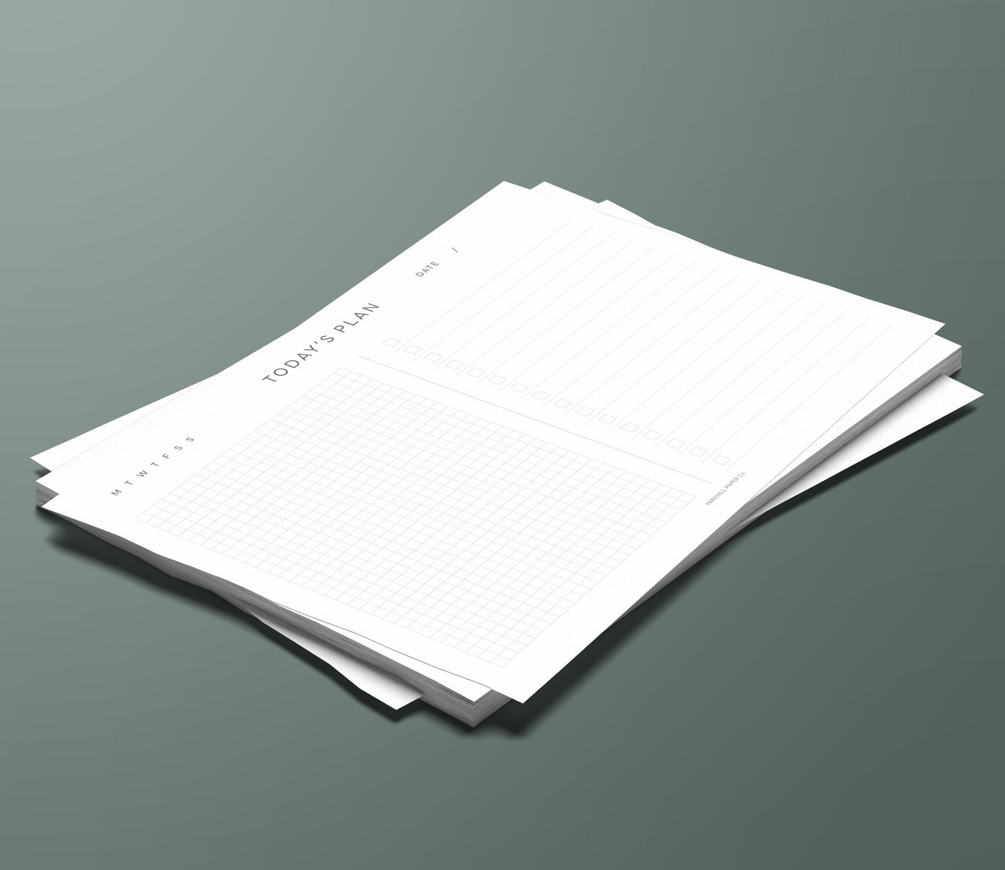 A set of Today's Plan planning pages sitting in a stack on a green background