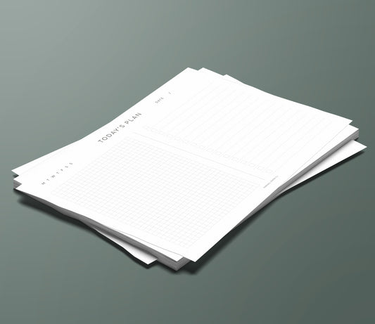 A set of Today's Plan planning pages sitting in a stack on a green background